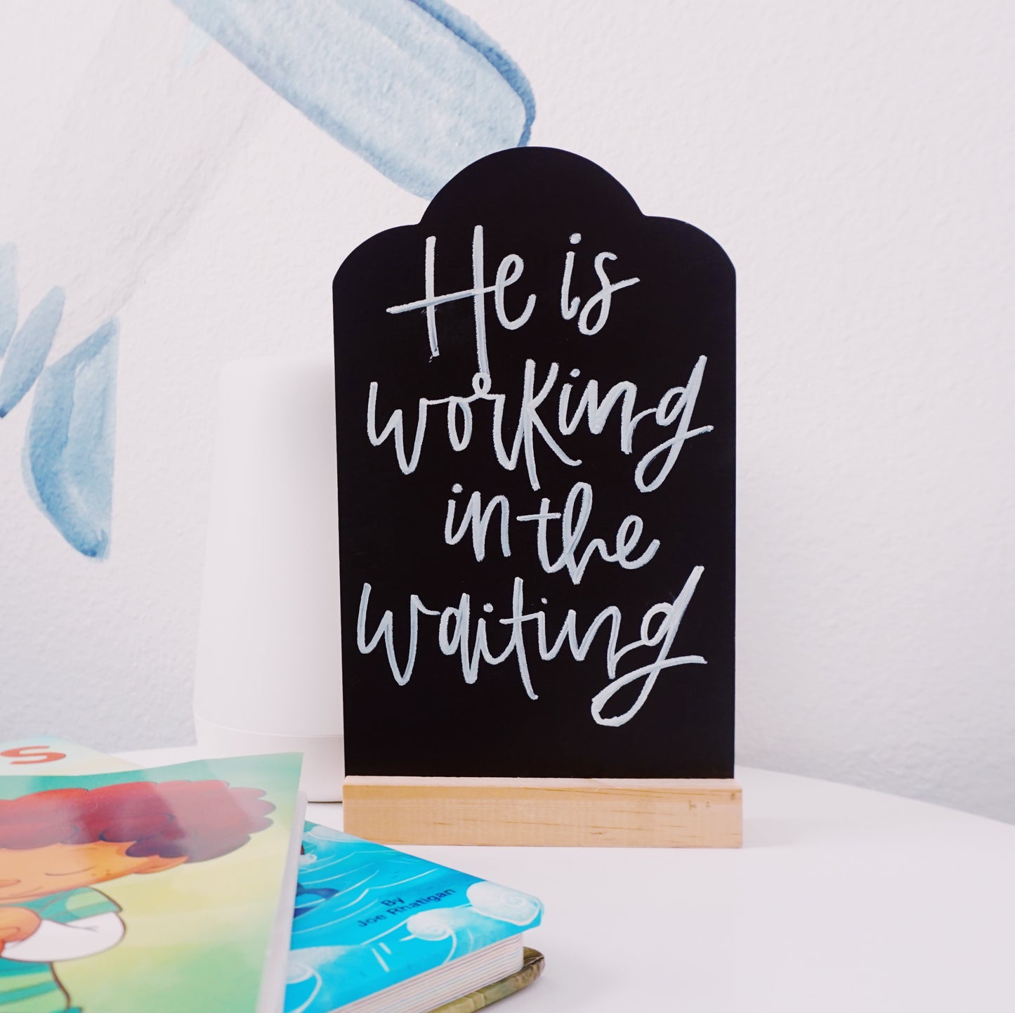 He Is Working in the Waiting - Tabletop Chalkboard Sign with Base - Light Color Wood